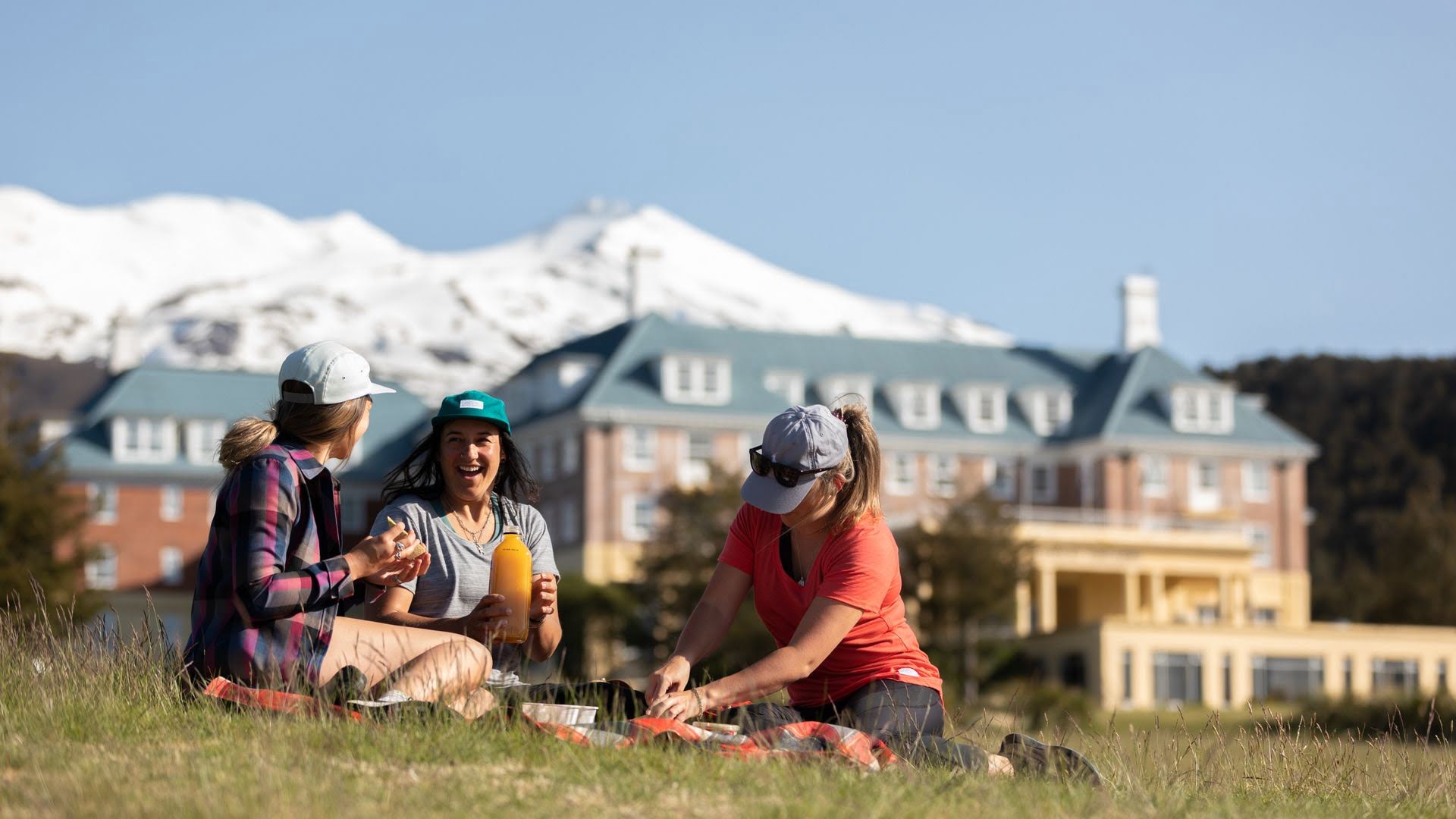 Friends enjoying a picnic outside the Chateau Tongariro Hotel in Whakapapa Village - Visit Ruapehu.jpg